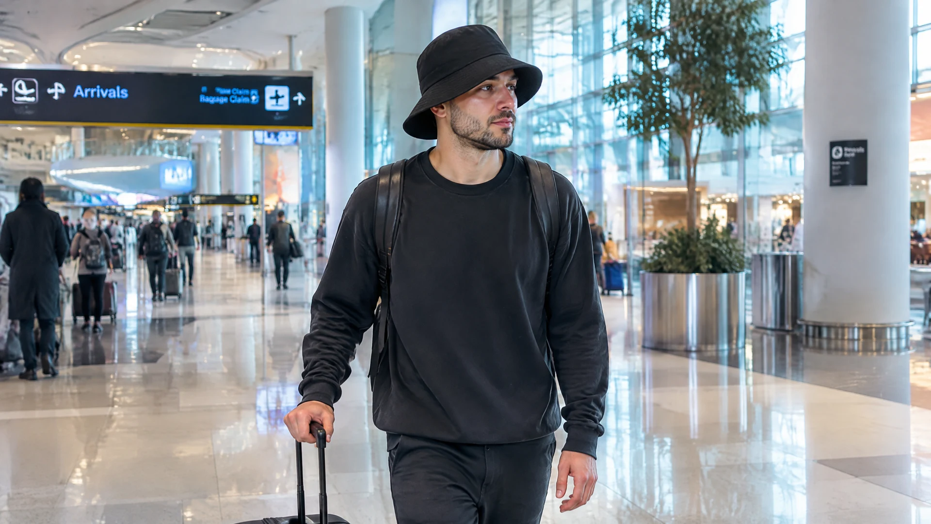 Passenger wearing a loose-fitting hat after a hair transplant while walking through an airport terminal